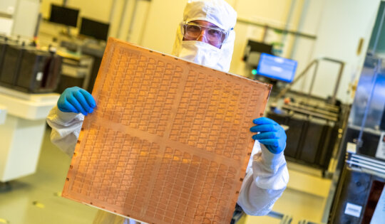 An Intel engineer holds a test glass core substrate panel at Intel's Assembly and Test Technology Development factories in Chandler, Arizona, in July 2023. Intel’s advanced packaging technologies come to life at the company's Assembly and Test Technology Development factories. (Credit: Intel Corporation)