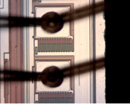 . Optical microscope image on the 1st layer (a) and the 2nd layer of flash memory stacked die (b) in the SiP module after MIP decapsulation