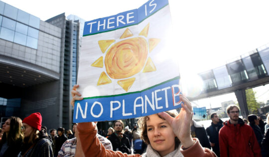 Brussels, Belgium. 3rd Nov. 2018.Activists hold placards and chant slogans during a demonstration to demand immediate an action on climate change in front of European Parliament.