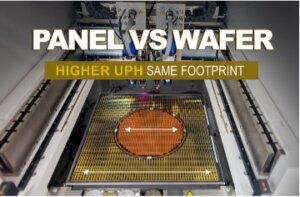 A semiconductor wafer shown on top of a semiconductor panel, inside of a machine. Panel vs. wafer; higher UPH same footprint. Fluid dispensing.
