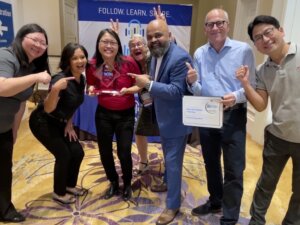 Figure 4: Henkel winning Supplier of the Year Award, presented by 3D InCites, at ECTC 2023