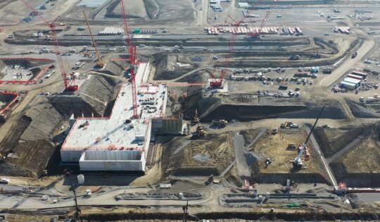 An aerial view from February 2024 shows construction progress at Intel's Ohio One campus of nearly 1,000 acres in Licking County, Ohio. Intel announced plans in January 2022, to invest more than $20 billion in the construction of two new leading-edge chip factories in Ohio. The company broke ground in September 2022. The investment will serve the needs of Intel Foundry customers as part of the company’s IDM 2.0 strategy. (Credit: Intel Corporation)